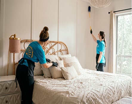 professional cleaning services being performed in a residential bedroom
